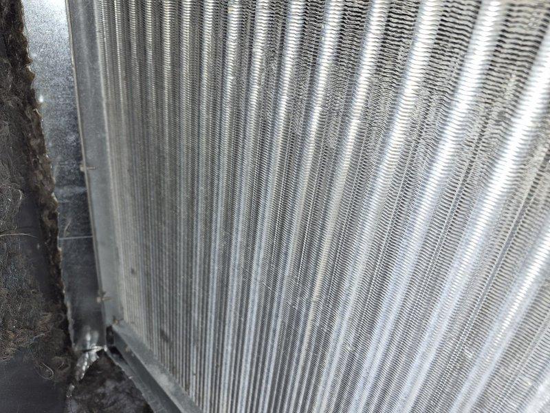Completed comprehensive tune-up and maintenance service on residential air conditioning and air handler system. Performed thorough inspection of evaporator coil, confirming clean fins with proper alignment and no blockage, and verified blower wheel assembly showing normal operation with all blades intact. Replaced 12x20x1 air filter to maintain optimal airflow and system efficiency.