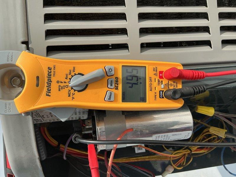 Completed air conditioning and air handler clean and check maintenance service on 1 system. Performed comprehensive inspection of electrical components including capacitor, contactor, and all associated wiring connections. Measured system amperage at 45 amps using clamp meter to verify proper electrical operation. Verified all wire connections were secure with proper terminations and wire management. System found operating within normal parameters with no filter replacement needed at this time.