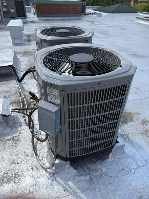 Completed preventive maintenance tune-up on single HVAC system including rooftop air conditioning condenser unit and interior air handler. Performed standard inspection procedures, replaced 16x20x1 air filter, and verified proper system operation. Documented equipment condition with photos showing rooftop condenser units and attic access panel with insulated frame.