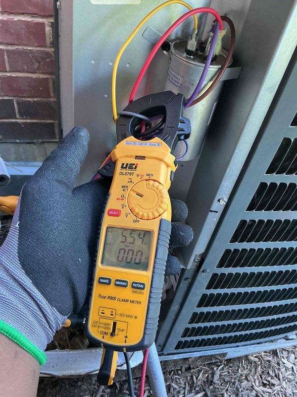 Completed Silver Comfort Plan clean and check on one AC system for new customer. Performed comprehensive maintenance inspection, documented all equipment information and model numbers, tested dual-run capacitor (50/5µF, 440VAC) with meter confirming proper readings, verified electrical connections and component operation, and captured detailed photos of system components for service records.