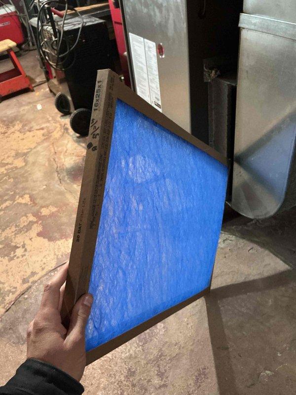 Completed annual Comfort Plan maintenance on single HVAC system including clean and check procedures on outdoor condensing unit and indoor air handler. Inspected electrical components, capacitor, contactor assembly, and wiring connections in outdoor unit with access panel removed; all components found in serviceable condition with proper terminations. Replaced indoor air filter with new blue media filter in cardboard frame. Verified system operation and confirmed all equipment functioning within normal parameters for continued comfort plan coverage.