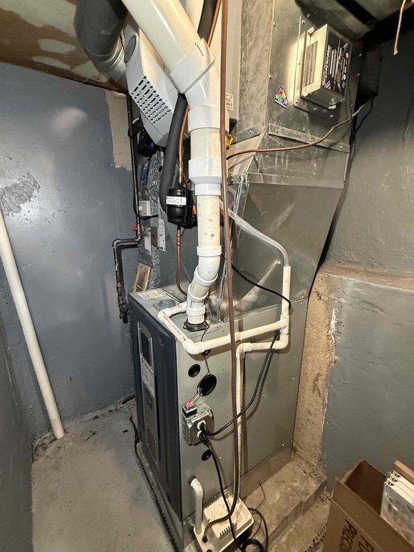 Completed scheduled maintenance callback on residential HVAC system. Performed electrical diagnostics on outdoor condensing unit using multimeter to verify proper voltage and component functionality. Tested capacitor connections and confirmed all wire terminations were secure. Inspected indoor furnace unit in basement, including PVC condensate drain lines, refrigerant line connections, and electrical control panel. All components operating within normal parameters with no deficiencies noted. System tested and left in proper working condition.