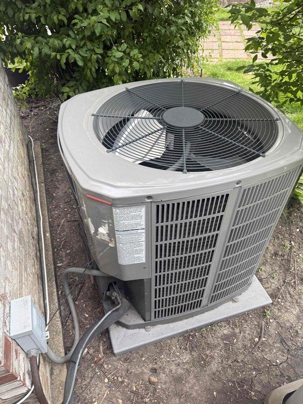 Replaced defective dual run capacitor (70/7.5 MFD) under warranty on residential air conditioning condenser unit. Removed failed OEM capacitor and installed TITAN PRO model TRCFD7075 replacement, reconnected all electrical terminals, and verified proper system operation. Unit returned to normal functionality with all components operating within specifications.