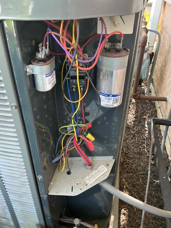 Completed annual clean and check maintenance on air conditioning system per service comfort plan agreement. Performed comprehensive inspection of outdoor condensing unit, including electrical components, capacitors, contactor, and refrigerant line connections. All components found operating within normal parameters with temperature readings confirming proper system performance at 42.43°F.