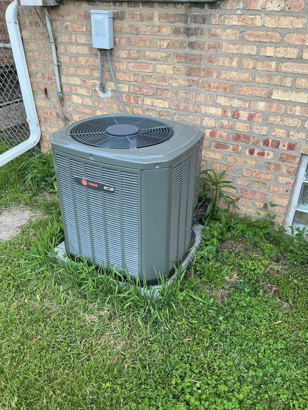 Performed comprehensive clean and check maintenance on Trane air conditioning system per comfort plan agreement. Inspected outdoor condensing unit, confirmed proper operation of compressor and condenser fan motor, and verified electrical connections at exterior junction box. Measured supply air temperature at 46.5°F, indicating adequate cooling performance and proper refrigerant charge levels.