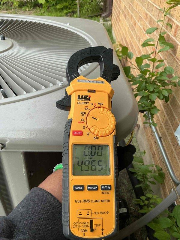 Completed preventative maintenance clean and check on single air conditioning system per service contract plan. Performed electrical diagnostics using digital clamp meter to verify proper amperage draw and system operation at outdoor condensing unit. Inspected evaporator blower assembly, confirming fan wheel and motor components are clean and functioning correctly with no obstructions or debris buildup.