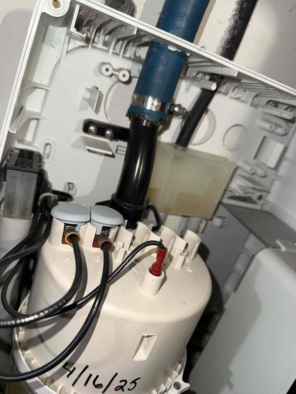 Performed prepaid maintenance visit and filter inspection on HVAC system. Inspected whole-home humidifier assembly and identified failed water treatment canister requiring replacement. Documented existing humidifier configuration including digital control panel, water supply connections, and electrical components. Replacement canister has been ordered and is awaiting delivery for follow-up installation to complete cleaning and maintenance service.