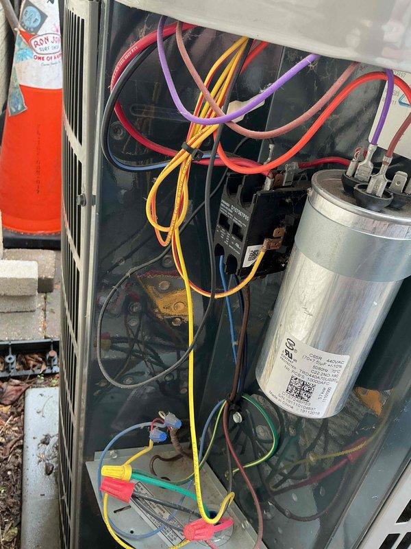 Completed comprehensive clean and check maintenance service on air conditioning system and air scrubber unit per comfort plan agreement. Performed thorough system diagnostics including electrical testing at disconnect box, verified proper voltage and amperage readings, inspected all wire connections and terminals for secure contact, and tested capacitor performance with digital multimeter. All electrical components operating within manufacturer specifications, system cooling efficiently with no deficiencies noted.