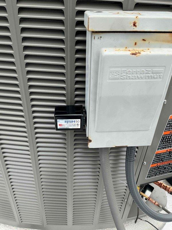 Completed HVAC system installation warranty service for condenser unit experiencing operational failure. Unit was not turning on and displayed low pressure error code. Allowed system to stabilize for minimum 30 minutes before diagnostics. Inspected and serviced control board with integrated LED status indicator and terminal connections. Verified proper wiring configuration including ribbon cable connections and terminal block integrity. Installed RSH50 monitoring device on exterior disconnect box for system tracking. Tested electrical connections at service disconnect panel. Confirmed condenser operation restored and all error codes cleared. System now functioning within normal operating parameters.