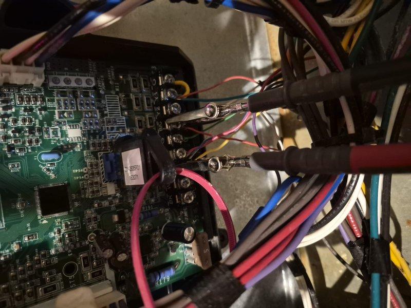 Responded to no cooling complaint on residential air conditioning system. Upon arrival, verified unit was not powering on at thermostat. Performed diagnostic evaluation of HVAC system including inspection of electrical components, control board, and wiring connections. Removed access panels to examine internal circuitry, capacitors, and terminal connections. Identified failed control board preventing system operation. Documented equipment condition with photos showing circuit board assembly, wire harnesses, and electrical connections. Discussed repair options and recommended replacement of defective control board to restore cooling functionality.