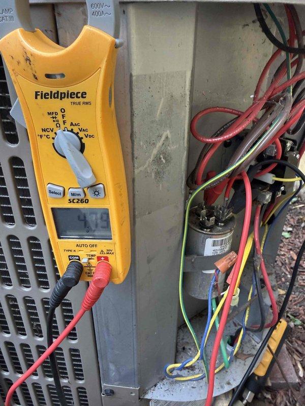 Completed Comfort Plan clean and check maintenance on single air conditioning system with no reported issues. Performed comprehensive inspection including temperature differential measurements showing 72.2°F, electrical testing with TRUE RMS meter to verify proper voltage and amperage at capacitor and electrical components, and replaced air filter. System operating within normal parameters with all electrical components testing within manufacturer specifications.