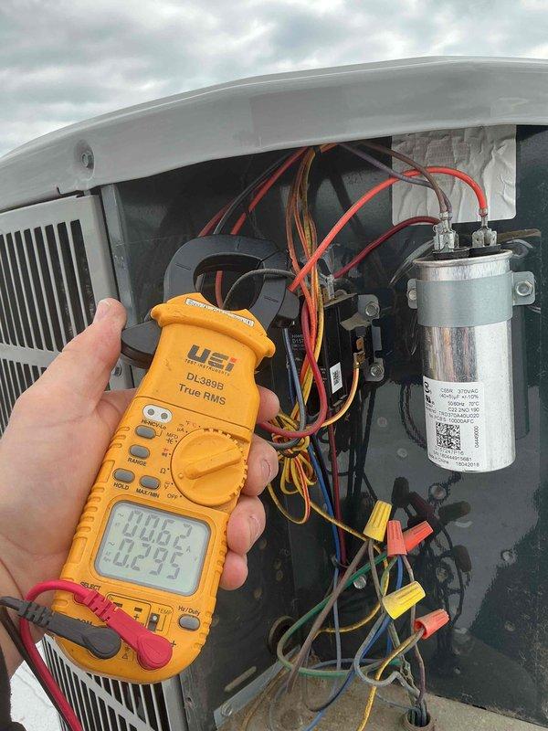 Completed preventive maintenance tune-up on single HVAC system. Performed comprehensive electrical diagnostics using digital multimeter to verify capacitor performance and system voltage readings. Replaced air filter and inspected all electrical connections, contactors, and components within condensing unit. System operating within normal parameters with all readings documented.