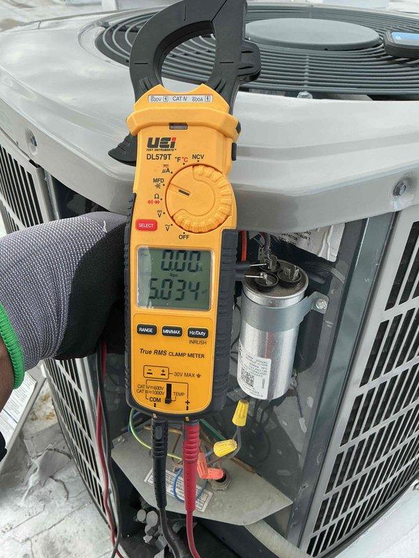 Completed preventive maintenance tune-up on single air conditioning system. Performed electrical diagnostics on outdoor condenser unit using digital clamp meter, verifying amperage draws and capacitor performance within manufacturer specifications. Replaced 16x20x1 air filter at air handler. Measured supply air temperature at 132.2°F, confirming proper heat strip operation and system functionality. All components tested and operating normally with no deficiencies noted.
