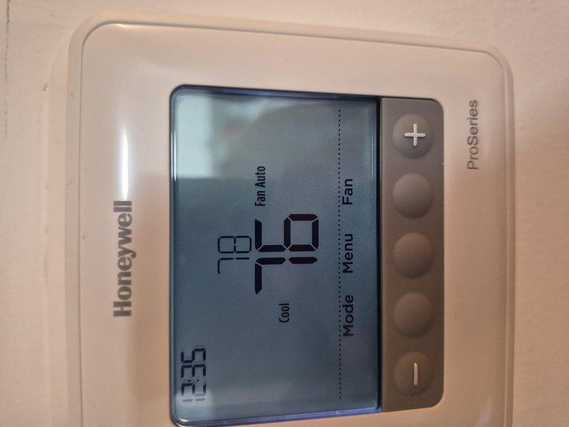 Performed complete tune-up and diagnostic inspection on rooftop air conditioning system. Conducted electrical testing using digital multimeter to verify capacitor functionality and contactor operation, confirming all readings within manufacturer specifications. Replaced air filter and verified thermostat operation showing proper communication with cooling equipment at 40°F setpoint in auto fan mode.