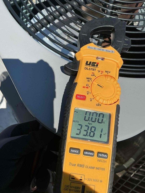 Completed comprehensive tune-up and clean-and-check service on single-system HVAC unit for new customer. Installed 12x20x1 air filter, performed electrical diagnostics using clamp meter showing 452V and 238.1V readings with 400-amp capacity verification, and inspected all system components including capacitor and wiring connections. Customer expressed interest in upgrading to large-display thermostat for improved readability.