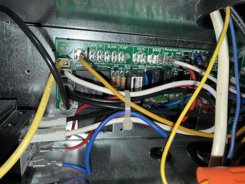 Performed comprehensive spring tune-up on single-system air conditioning unit and air handler. Inspected evaporator coil and noted dust accumulation on aluminum fins; verified copper refrigerant lines and U-bend configuration for proper connection and integrity. Examined control board wiring and terminal connections including motor, blower, pump, and valve circuits; confirmed all electrical connections secure and system operational. Replaced air filter and verified unit clean and clear for cooling season operation.