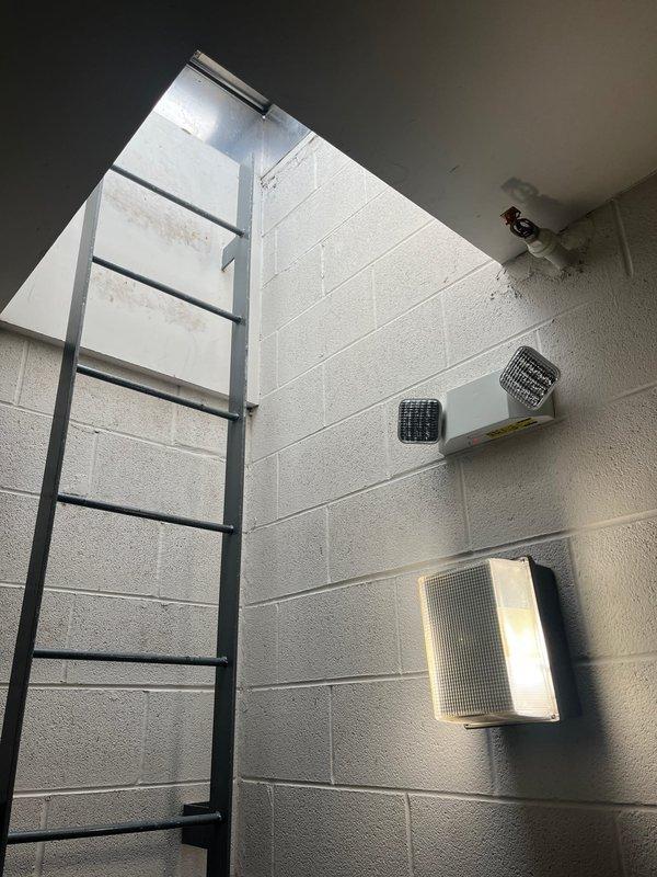 Responded to service call for air conditioning system that had lost cooling capacity over the past month and subsequently experienced complete system shutdown including thermostat failure. Accessed rooftop-mounted HVAC unit via interior ladder and hatch to perform comprehensive system evaluation. Upon inspection, determined that the aging equipment had reached end of serviceable life and recommended full system replacement rather than repair due to the extent of component failure and age of the existing unit.