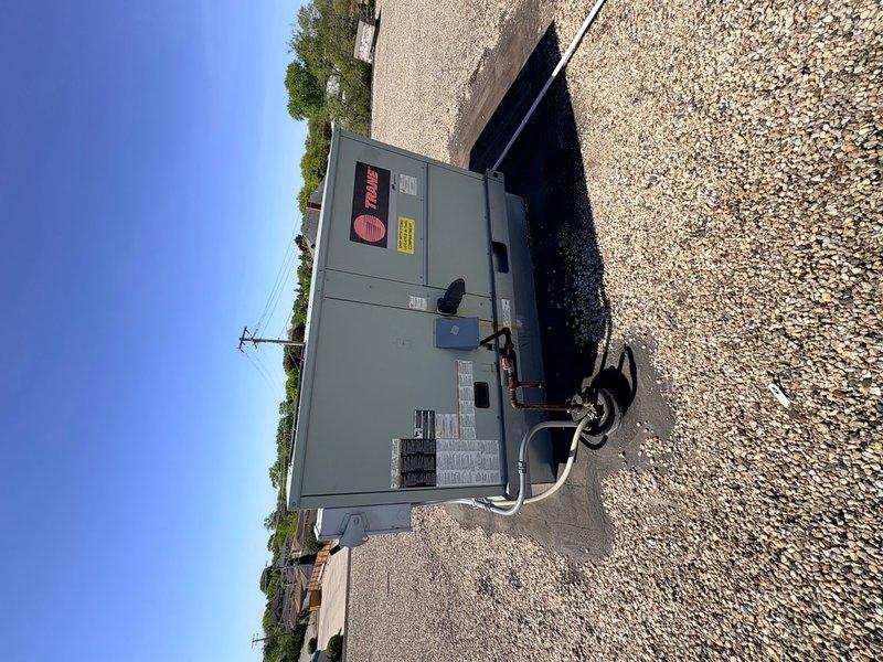 Responded to callback for recurring noise complaint on rooftop HVAC unit. Accessed roof-mounted package unit during dry weather conditions as requested. Performed visual inspection of unit exterior, cabinet panels, and mounting hardware. Documented equipment condition with photographs showing gray cabinet-style RTU positioned on gravel pad with electrical conduit connections. Unit appeared secure on pad with no visible loose components or damaged panels during static inspection. Unable to replicate noise condition at time of visit. Recommend monitoring unit during operation and scheduling follow-up visit when noise is actively occurring to properly diagnose source of intermittent sound.