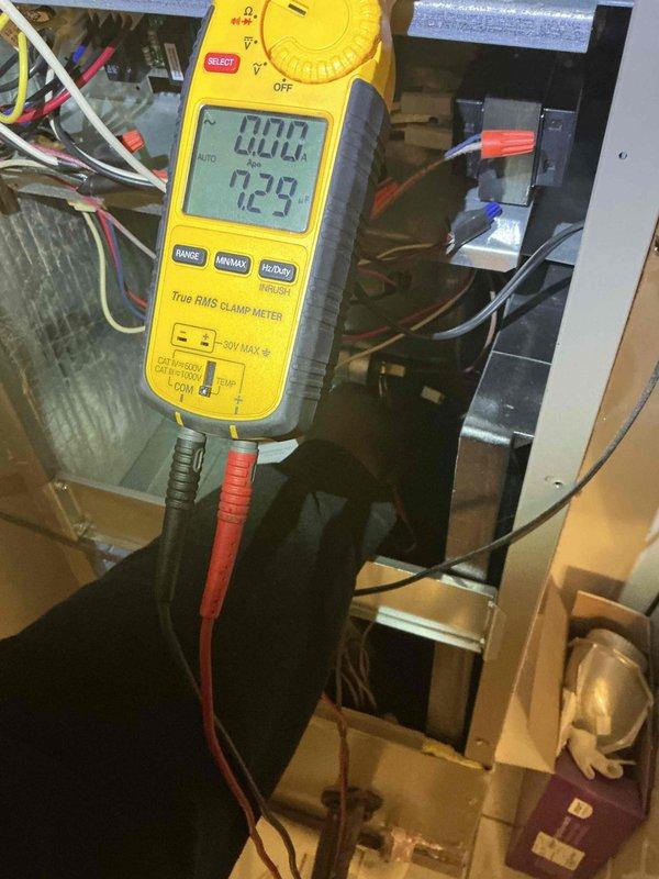 Completed air conditioning and air handler clean and check service on single-system residential unit. Performed comprehensive system inspection, replaced air filter, and verified electrical readings with clamp meter showing proper amperage draw at 72.9 amps. Addressed significant frost accumulation observed on supply register grate, indicating potential airflow restriction or low refrigerant charge condition that required attention during tune-up process. System operational upon completion with all components functioning within normal parameters.