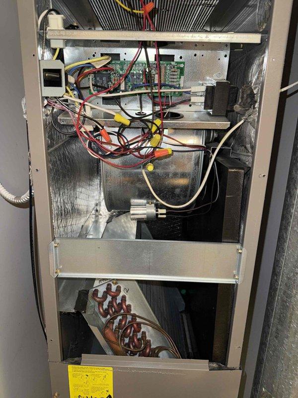 Completed preventative maintenance tune-up on residential split HVAC system. Inspected indoor air handler and outdoor condensing unit, verified proper operation of all electrical components including circuit board connections and wiring, examined evaporator coil and blower assembly, and checked condenser fan operation. Replaced 12x20x1 air filter and confirmed system clean and clear with no concerns noted.