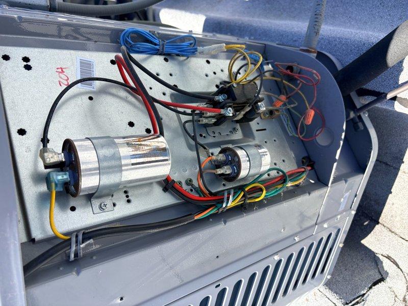 Performed complete air conditioning and air handler tune-up maintenance on single-zone HVAC system. Conducted comprehensive system inspection including electrical components, capacitors, and motor connections. Replaced 12x20x1 air filter and verified all wiring connections were secure. Inspected dual capacitor assembly and electrical control cabinet, confirming all components operating within normal parameters. System tested and left in proper working condition.
