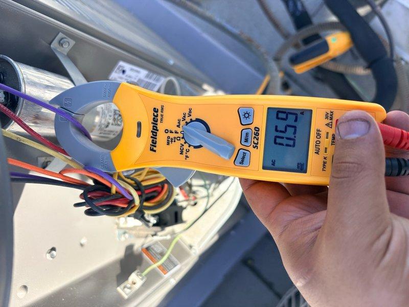 Completed clean and check service on single-system air conditioning unit and air handler. Unit was found operating without a filter installed. Performed comprehensive tune-up including inspection of outdoor condenser unit, electrical connections, and refrigerant lines. Measured amperage draw at 0.7 amps using clamp meter to verify proper compressor operation. Installed replacement filter in air handler. System tested and confirmed operational within normal parameters following service completion.
