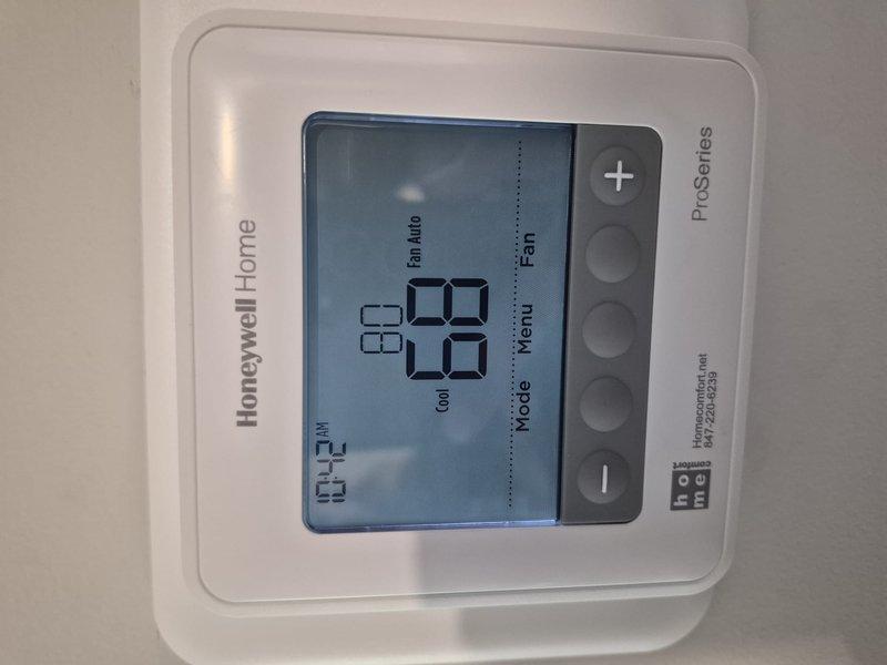 Completed Comfort Plan clean and check maintenance on single-system air conditioning unit. Performed comprehensive inspection of outdoor condenser unit with cylindrical fan assembly, verified proper operation of all components, and confirmed Honeywell Home ProSeries thermostat functionality with system set to cooling mode at 70 degrees. All maintenance services provided under member's Comfort Plan coverage with no additional charges assessed.