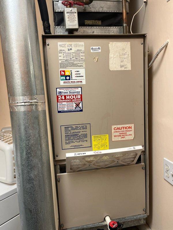 Completed comprehensive evaluation of existing Magic Aire air handler and associated air conditioning system for replacement estimate. Documented current equipment condition through detailed photography, noting aging ductwork with surface oxidation, existing refrigerant lines with ball valve assembly, and evaporator coil housing. System assessment included inspection of condensate drainage, electrical connections, filter accessibility, and overall installation configuration within confined mechanical space to determine replacement specifications and requirements.