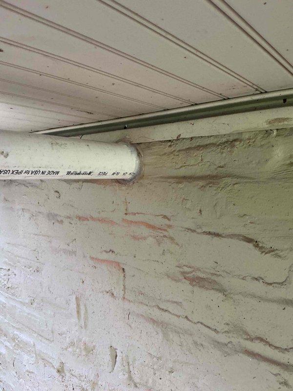 Removed and disposed of existing conventional water heater, then installed one Rinnai Sensi RXP199IN 199,000 BTU tankless water heater. Ran new PVC exhaust venting system through exterior wall and reconfigured gas piping to accommodate the new unit. Connected tankless heater to existing household water lines with new isolation and purging valves installed for future maintenance access. Installed recirculation valve under the furthest fixture to provide instant hot water delivery. Completed startup procedures, tested all connections for leaks, adjusted system settings for optimal performance, and performed comprehensive safety inspection to ensure proper operation of all components.