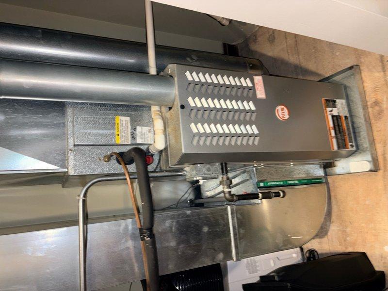 Completed HVAC system estimate for replacement of existing heating and cooling equipment. Assessment included evaluation of indoor Payne furnace unit with associated ductwork and plenum connections in basement mechanical room, as well as outdoor cylindrical condenser unit positioned on concrete pad adjacent to building exterior. Provided comprehensive pricing options for new system installation including equipment specifications, labor requirements, and necessary modifications to existing infrastructure.