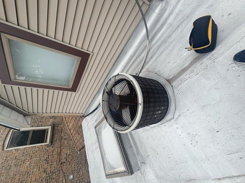 Completed HVAC system estimate for replacement of existing heating and cooling equipment. Assessment included evaluation of indoor Payne furnace unit with associated ductwork and plenum connections in basement mechanical room, as well as outdoor cylindrical condenser unit positioned on concrete pad adjacent to building exterior. Provided comprehensive pricing options for new system installation including equipment specifications, labor requirements, and necessary modifications to existing infrastructure.