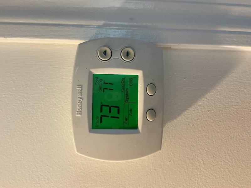 Responded to no cooling complaint on second floor of residence. Upon arrival, inspected recently installed condenser unit and indoor air handler system. Verified thermostat operation showing 71°F actual temperature with 73°F setpoint. Checked air handler unit with proper labeling and condensate drain lines intact. Performed diagnostic testing on complete HVAC system to identify cause of cooling failure. Completed warranty repair work on AC system components. System restored to proper operation with adequate airflow and cooling capacity confirmed before departure.