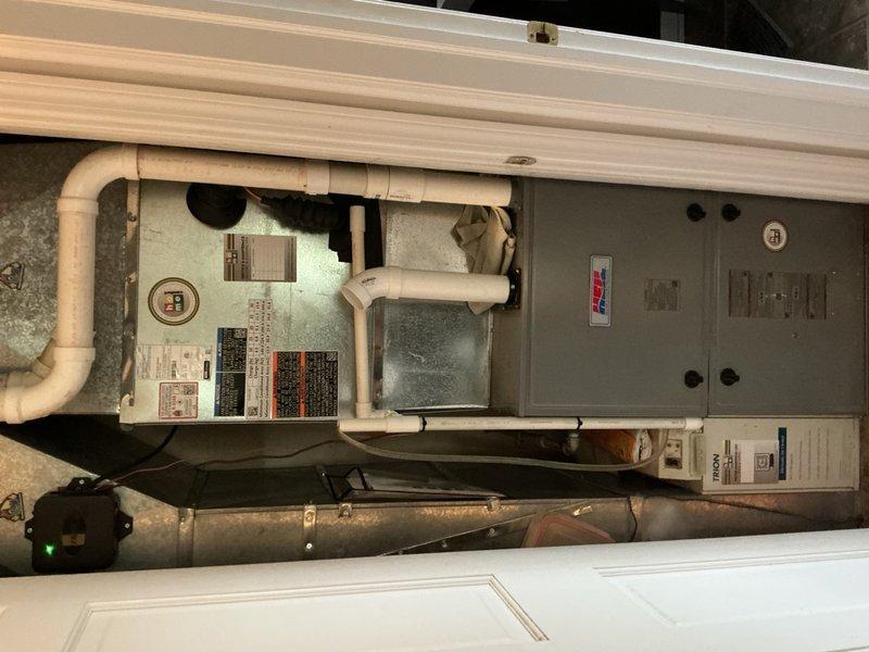 Responded to no cooling complaint on second floor of residence. Upon arrival, inspected recently installed condenser unit and indoor air handler system. Verified thermostat operation showing 71°F actual temperature with 73°F setpoint. Checked air handler unit with proper labeling and condensate drain lines intact. Performed diagnostic testing on complete HVAC system to identify cause of cooling failure. Completed warranty repair work on AC system components. System restored to proper operation with adequate airflow and cooling capacity confirmed before departure.