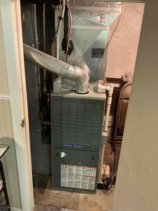Completed comprehensive tune-up on American Standard furnace system and addressed customer concern regarding air filter installation. Verified proper filter placement and operation, inspected capacitor and electrical components, and confirmed all system functions operating within normal parameters.