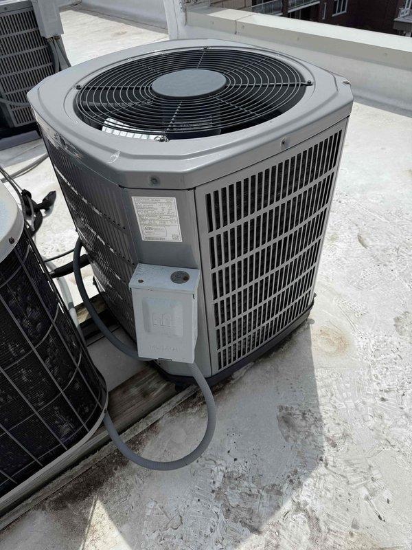 Responded to no cooling complaint on rooftop air conditioning unit that had been running continuously for 45 minutes without achieving setpoint of 72°F. Upon inspection, found outdoor condenser unit operational but system failing to cool effectively. Accessed internal electrical compartment and discovered failed dual run capacitor preventing proper compressor and condenser fan operation. Replaced defective capacitor with manufacturer-specified component, verified proper electrical connections, and tested system operation. Unit cycled properly and began producing cold air at supply registers. Documented equipment information and captured photos of outdoor unit and internal electrical components for service records.