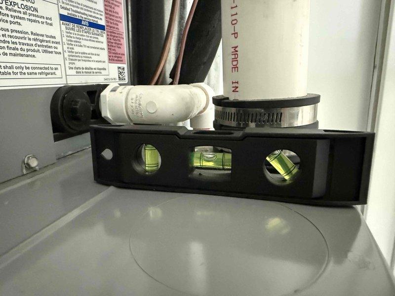 Responded to follow-up service call for ongoing condensate leak on second-floor air conditioning system less than five years old. Performed comprehensive diagnostic evaluation of cooling equipment and drainage system to identify root cause of persistent water leakage issue that continued after previous service attempt. Utilized refrigerant manifold gauges to verify system pressures and operating temperatures, confirming compressor discharge pressure at 381.5 psi and monitoring superheat/subcooling values. Inspected evaporator coil drain pan, condensate drain line, and trap assembly for blockages or improper pitch. Checked condenser unit level and verified proper installation to ensure correct refrigerant flow and drainage. Identified underlying issue causing repeated condensate overflow and provided repair options to resolve water damage concerns before summer cooling season.