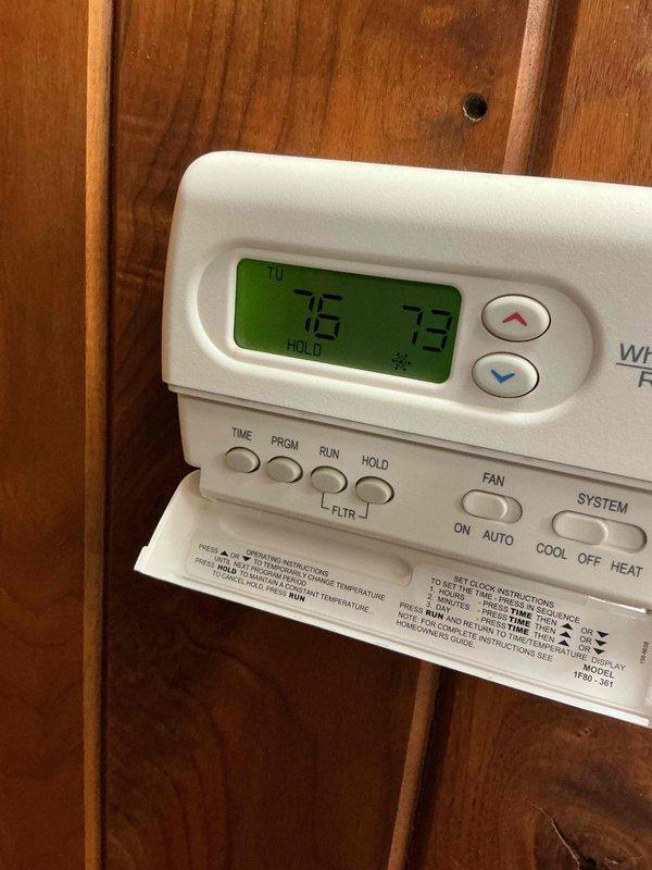 Responded to no cooling complaint for commercial office air conditioning unit. Upon arrival, accessed office and evaluated outdoor condenser unit and interior thermostat which displayed a 75°F setpoint with 73°F room temperature. Verified unit operation, assessed system components, and confirmed proper thermostat functionality after customer had previously attempted troubleshooting including battery and fuse replacement.