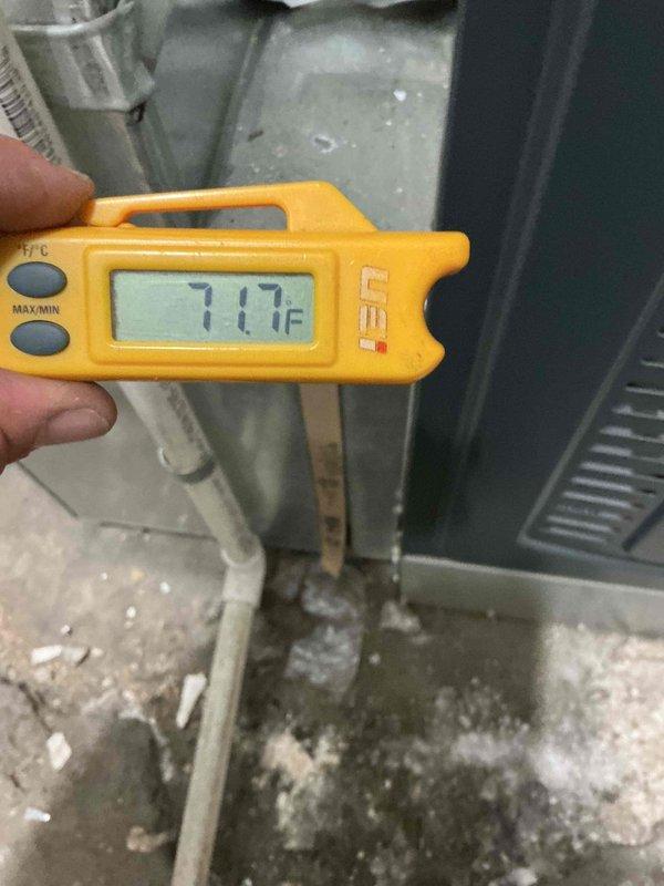 Responded to no-power complaint on residential air conditioning system. Upon arrival, found unit completely non-responsive with no power supply to outdoor condenser. Performed diagnostic testing and traced electrical circuit from thermostat through furnace control board to outdoor disconnect. Measured temperature readings at equipment location showing 71.7°F ambient temperature in mechanical room. Documented existing HVAC installation including furnace unit and associated ductwork in basement location. Collected equipment model and serial number information for service records. Presented flat rate repair options to restore cooling operation and discussed preventive maintenance program enrollment. Additional diagnostic time required beyond initial service call to isolate root cause of electrical failure.