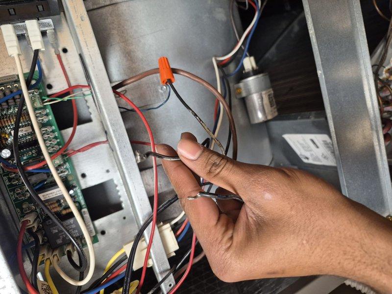 Responded to callback for air conditioning system not cooling following recent building-wide maintenance. Upon inspection, discovered loose electrical connections at control board that were inadvertently disturbed during previous service visit. Reconnected and secured all wiring terminals, verified proper voltage at capacitor and compressor connections, and tested system operation. Unit now cooling properly with all electrical connections secure and condensate drainage functioning as designed.