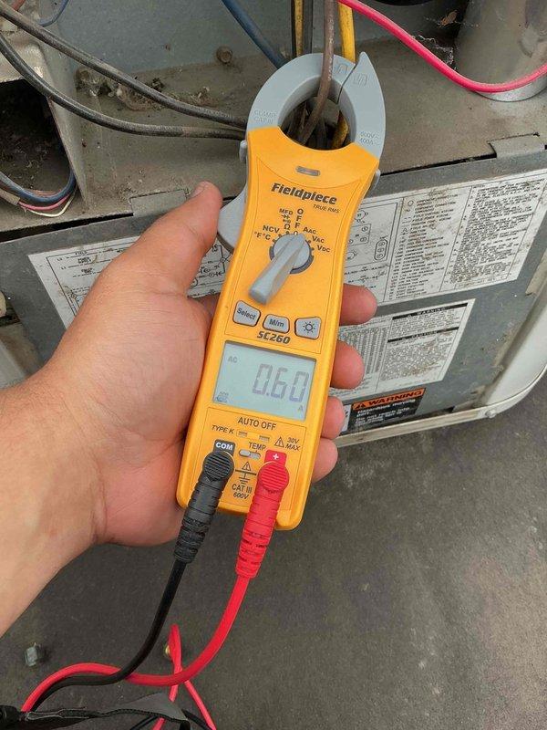 Responded to no cooling complaint where system was not maintaining set temperature. Located HVAC unit in basement utility area. Performed diagnostic testing using clamp meter to verify electrical readings and system operation. Identified and resolved issue preventing proper cooling function. System restored to normal operation with appropriate temperature control functionality.
