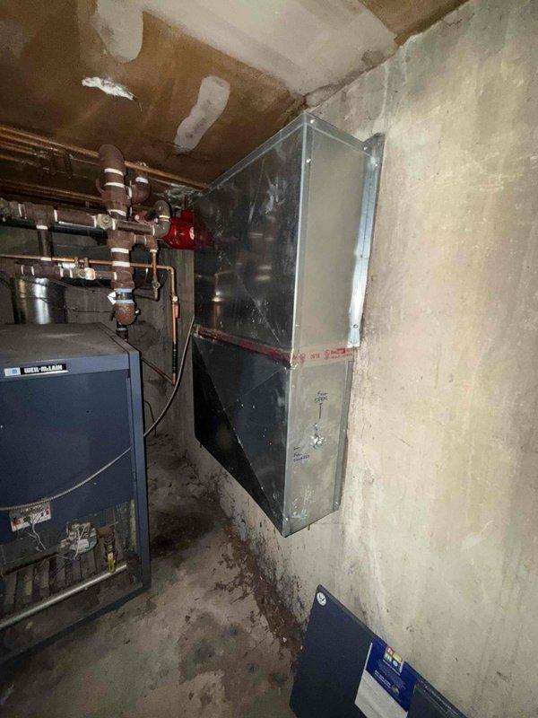 Responded to no cooling complaint on first floor. Upon arrival, inspected mechanical room and utility chase area. Found heating system valves in open position with boiler still operational during cooling season. Identified control wiring and zone valve configuration serving affected area. Documented existing plumbing infrastructure including copper piping, shut-off valves, and HVAC controls. Contacted office to report findings and coordinate approval process with property management for necessary repairs. Photographed mechanical equipment, valve positions, and control panel for documentation purposes.