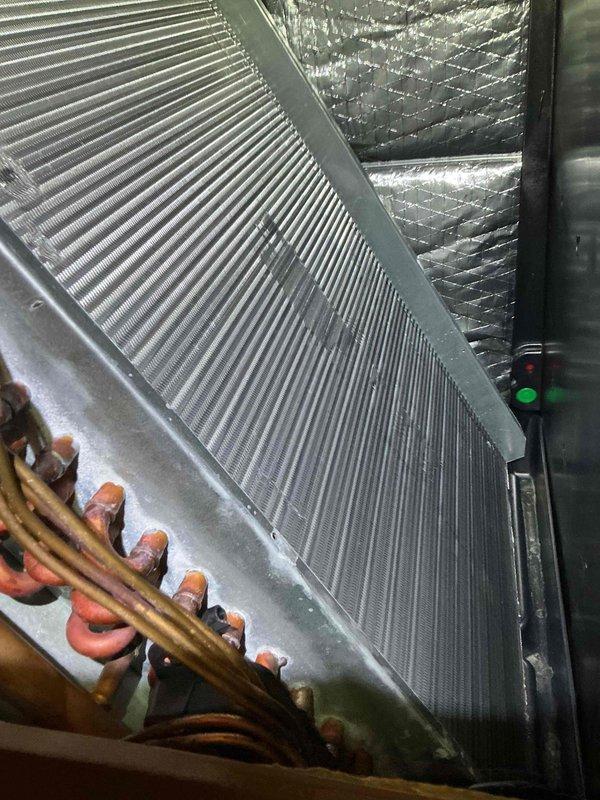 Completed comprehensive tune-up and maintenance on single-system air conditioning and air handler unit. Performed electrical diagnostics using clamp meter, recording amp draw of 20.5 amps to verify compressor performance within manufacturer specifications. Inspected evaporator coil assembly, confirmed proper fin alignment and cleanliness, and verified refrigerant line connections with no signs of active leakage. System operational and functioning as designed upon completion.