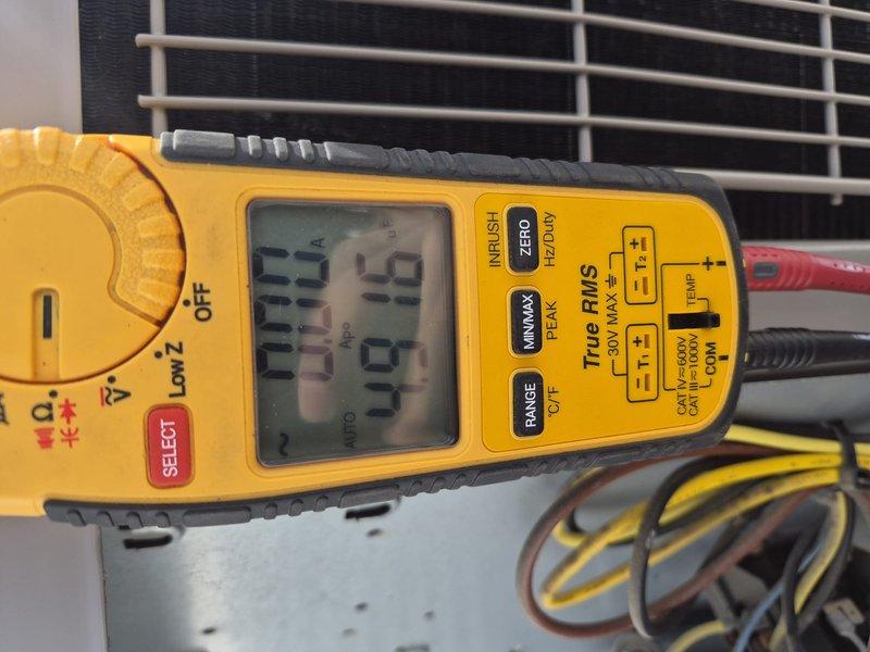 Completed air handler and air conditioning clean and check per building special maintenance agreement. Performed visual inspection of evaporator coil assembly and refrigerant line connections, verified system components accessible in confined installation space, and conducted electrical diagnostics using digital multimeter to confirm proper system operation. Customer declined filter replacement at time of service.