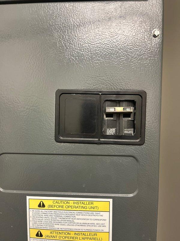 Completed estimate for 2.5 ton air conditioning system replacement at unoccupied property. Assessed existing indoor air handler unit with humidifier and evaluated electrical disconnect panel with dual circuit breakers for compatibility with new equipment installation.