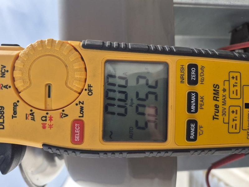 Completed comprehensive tune-up on air conditioning and air handler system. Performed electrical diagnostics using clamp meter to verify proper amperage draw and voltage readings across system components, documenting readings of 333V, 25A, 20.01A, and 30.13V at various test points. Inspected heat exchanger coils, circuit board, and all electrical connections for proper operation. Installed 18x20x1 air filter, entered equipment information into system database, and captured documentation photos of diagnostic procedures and equipment condition.