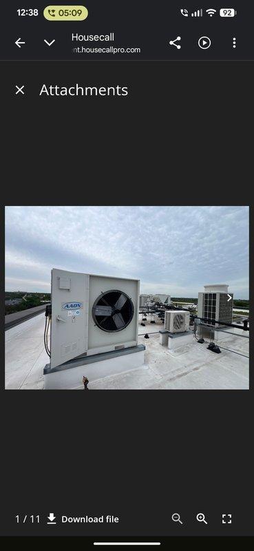Responded to commercial property for no cooling complaint with rooftop unit not operating. Accessed roof using provided entry code and located affected white packaged HVAC unit among multiple rooftop installations. Performed diagnostic inspection of unit and documented equipment condition with photographs for service records.