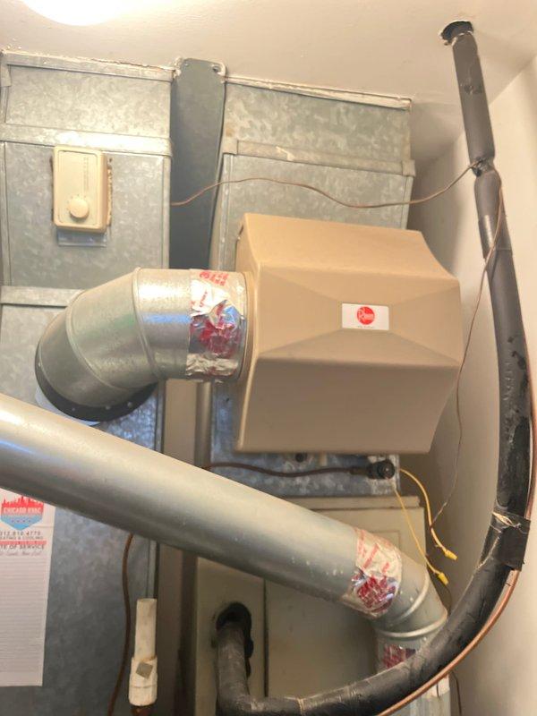 Completed HVAC system replacement estimate for residential property requiring 1.5 ton air conditioning unit installation on roof with crane access and furnace replacement in interior closet. Assessed existing Rheem Classic Quiet 80 furnace installation with associated ductwork, copper refrigerant lines, and electrical connections. Documented current system configuration including galvanized sheet metal supply plenum, insulated flexible ductwork, and mechanical room layout to provide accurate replacement specifications. Evaluated roof access requirements for condenser placement and determined crane lift necessity due to site constraints. Provided comprehensive estimate for complete system replacement including new air handler, condensing unit, refrigerant line set, electrical upgrades, and ductwork modifications as needed for proper installation and code compliance.