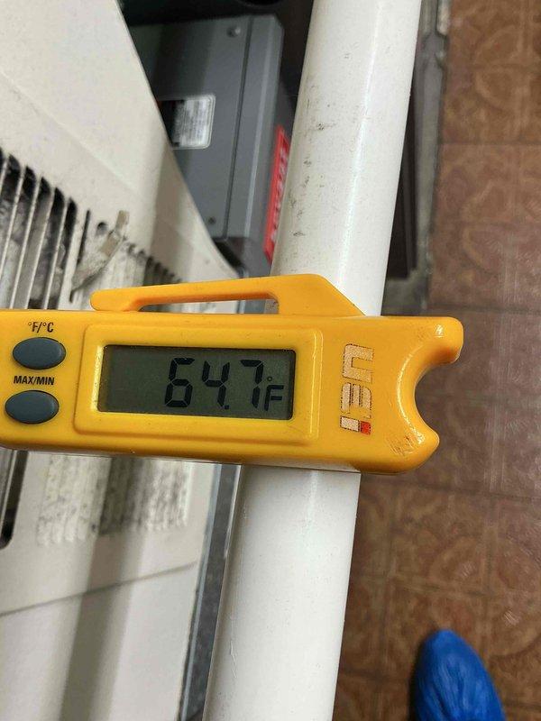 Completed comprehensive air conditioning clean and check maintenance per service comfort plan. Performed full system inspection of outdoor condensing unit and indoor components, verified proper refrigerant temperatures with digital thermometer reading 64.7°F at suction line, cleaned condenser coils, checked electrical connections and components, inspected drain lines and PVC piping, and confirmed all safety controls and operational parameters within manufacturer specifications. System operating efficiently with no deficiencies noted.