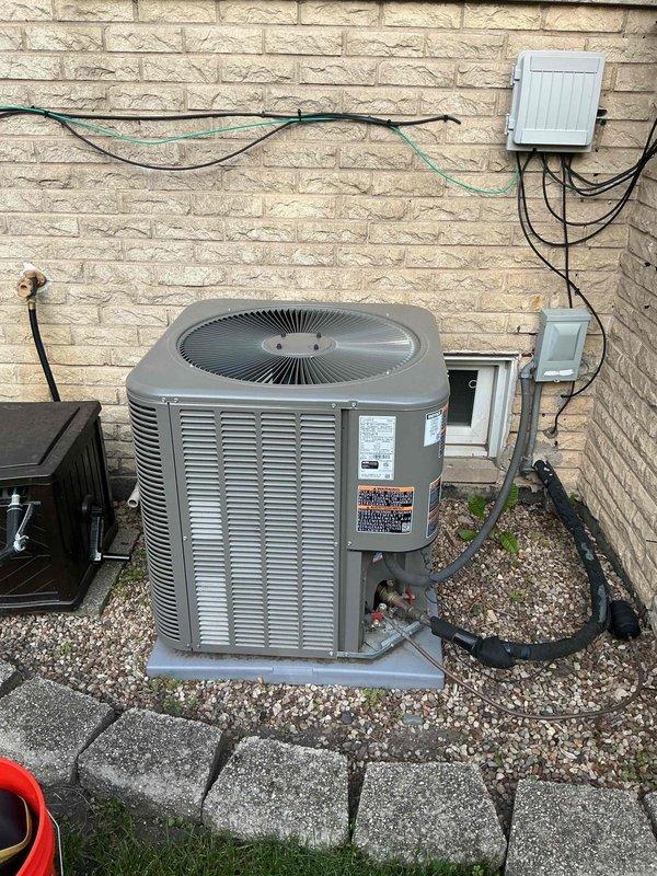 Completed comprehensive air conditioning clean and check maintenance per service comfort plan. Performed full system inspection of outdoor condensing unit and indoor components, verified proper refrigerant temperatures with digital thermometer reading 64.7°F at suction line, cleaned condenser coils, checked electrical connections and components, inspected drain lines and PVC piping, and confirmed all safety controls and operational parameters within manufacturer specifications. System operating efficiently with no deficiencies noted.