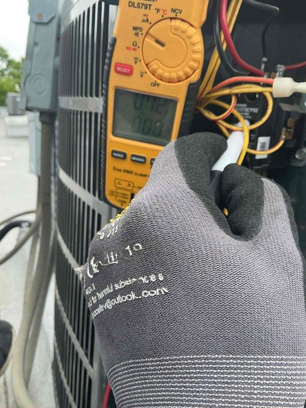 Completed comprehensive Comfort Plan clean and check service on 2.5-ton air conditioning system and air handler. Performed electrical diagnostics using digital multimeter, verifying voltage readings and system amperage draw at the outdoor condensing unit. Replaced 16x20x1 air filter at the air handler. Inspected condenser coil fins, tested all electrical connections, and confirmed proper system operation. All components operating within normal parameters with no deficiencies noted at time of service.